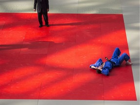 Jasmin Boisvert lies on the floor after being defeated in the Mens Black Belt 66Kg final by Matt Roots, (not seen). The Edmonton International Judo Championships hosted about 700 athletes from all over Canada at the Mayfield Toyota Ice Palace in West Edmonton Mall. Shaughn Butts / Postmedia