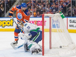 EDMONTON ALBERTA: December 31, 2016 Edmonton Oilers Patrick Maroon (19) watches the puck, fired by Drake Caggiula (36), not pictured, score on Vancouver Canucks goalie Jacob Markstrom (25) during second period NHL action at Rogers Place, in Edmonton December 31, 2016. AMBER BRACKEN/EDMONTON JOURNAL