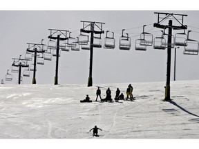 A skier makes his way towards the base of Rabbit Hill south of Edmonton on March 31, 2010 during the annual Slush Cup.