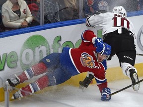 Edmonton Oil Kings Aaron Irving (24) and Red Deer Rebels Evan Polei (10) crash into the boards in WHL action at Rogers Place, the first-ever hockey game in the new arena in Edmonton Saturday, September 24, 2016. Ed Kaiser/Postmedia (Edmonton Journal story )