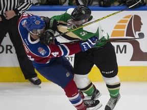 Edmonton Oil Kings Aaron Irving is hit by Prince Albert Raiders Dalton Yorke during first period WHL action on Friday, October 21, 2016 in Edmonton.