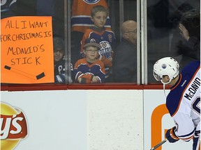 Edmonton Oilers captain Connor McDavid skates past fans during warmup during a previous game this month. (Kevin King)