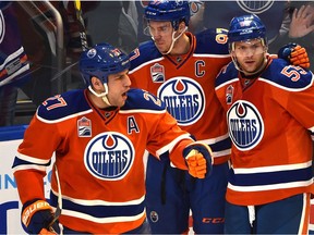 Edmonton Oilers Milan Lucic (27) celebrates his goal with Connor McDavid (97) and Mark Letestu (55) against the Tampa Bay Lightning during second period NHL action at Rogers Place in Edmonton, Saturday, December 17, 2016. Ed Kaiser/Postmedia (Edmonton Journal story by Jim Matheson) Photos off Oilers game for multiple writers copy in Dec. 18 editions.
