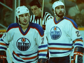 Edmonton Oilers defencemen Paul Coffey, left, and Charlie Huddy in an undated photo from the 1982-83 NHL season.