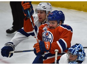 Edmonton Oilers Taylor Beck (45) and Tampa Bay Lightning Braydon Coburn (55) battle in front of goalie Ben Bishop (30) during first period NHL action at Rogers Place in Edmonton, Saturday, December 17, 2016. Ed Kaiser/Postmedia (Edmonton Journal story by Jim Matheson) Photos off Oilers game for multiple writers copy in Dec. 18 editions.