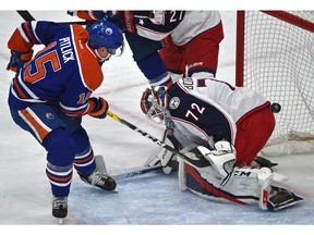 Edmonton Oilers Tyler Pitlick (15) scores on Columbus Blue Jackets goalie Sergei Bobrovsky (72) during the first period of NHL action at Rogers Place in Edmonton on Dec. 13, 2016.