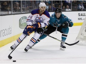 Zack Kassian of the Edmonton Oilers skates away from Brenden Dillon of the San Jose Sharks at SAP Center on December 23, 2016 in San Jose, California.