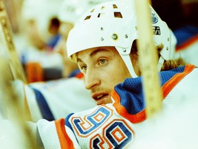 Edmonton Oilers star Wayne Gretzky on his team's bench during NHL action against the Los Angeles Kings on Dec. 5, 1982.