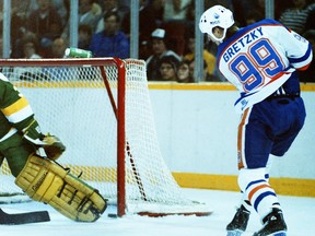 Edmonton Oilers centre Wayne Gretzky scores on Minnesota North Stars goalie Don Beaupre during NHL action at Northlands Coliseum on Dec. 6, 1987.