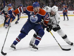 Edmonton's Leon Draisaitl (29) battles LA's Derek Forbort (24) during the second period of a NHL game at Rogers Place in Edmonton, Alberta on Thursday, December 29, 2016. Ian Kucerak / Postmedia