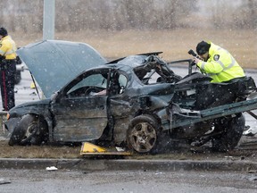 Police continue to investigate at the scene of a serious car accident along north bound Manning Drive near 50 Street, in Edmonton Alta. on Sunday March 13, 2016.