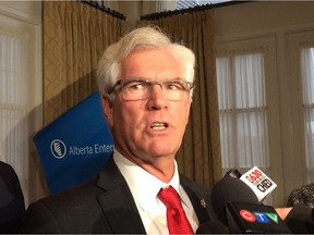 Federal Natural Resources Ministser Jim Carr speaks to reporters after an Alberta Enterprise Group-sponsored breakfast in Edmonton on Dec. 1, 2016. Carr responded to concerns that protests could delay or stop construction of pipeline projects approved earlier in the week.