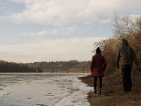 Ice crystals form as a couple walks along the north bank of the North Saskatchewan River near Victoria Park in Edmonton, Alberta on Friday, November 25, 2016.