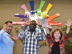 From left, Berhanu Demeke, Akol Akol and Lidija Simcisin, are intercultural liaisons with Edmonton Catholic Schools' One World ... One Centre. Once newcomers themselves, they now help settle new families into Edmonton schools.