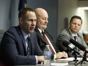 From left: Edmonton police staff sergeants Colin Derksen, Bill Clark and Duane Hunter give a year-end update on homicide cases at the Edmonton Police Service West Division station on Thursday, Dec. 15, 2016.