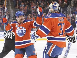 Edmonton Oilers' Matt Hendricks (23) and goalie Cam Talbot (33) celebrate the shootout win over the Tampa Bay Lightning during NHL action in Edmonton, Alta., on Saturday December 17, 2016.