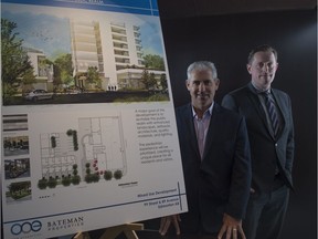 Mike Bateman and Tom Burr, vice-president of multi-family development for One Properties,  with renderings of proposed 28-storey building on site of Wild Earth Foods and Wild Earth Cafe on 99 Street and 89 Avenue on December 5,  2016.