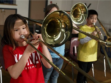 Music students in the Edmonton Symphony Orchestra and the Winspear Centre for Music's YONA-Sistema music  program play their real instruments for the first time during a ceremony at St. Alphonsus Catholic School in Edmonton, Alberta on Wednesday, December 7, 2016.