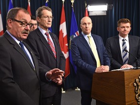 Opposition Leaders, left, Progressive Conservative Ric Mclver, Liberal David Swann, Alberta Party Greg Clark and Wildrose Brian Jean held a joint news conference on Tuesday Dec. 13, 2016 to boycott the government's all-party ministerial panel on the child-death review process.