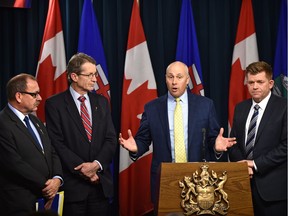 Progressive Conservative interim leader Ric Mclver, Liberal interim leader David Swann, Alberta Party Leader Greg Clark and Wildrose Leader Brian Jean (from left to right) held a joint news conference on Dec. 13, 2016, to present terms of reference they said were essential for opposition members to participate in the government-led child intervention panel.