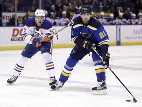 St. Louis Blues' Patrik Berglund, of Sweden, controls the puck as Edmonton Oilers' Connor McDavid, left, defends during the second period of an NHL hockey game Monday, Dec. 19, 2016, in St. Louis.
