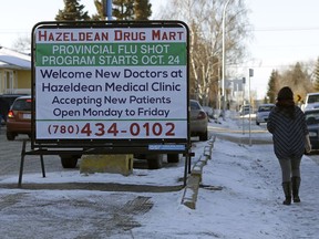 A woman takes a stroll in the community of Hazeldean on Dec. 19, 2016. The City of Edmonton is making it easier for neighbourhoods to reduce the residential speed limit.