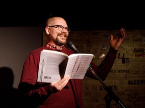 Poet Andy Weaver reads some of his work during the Olive Reading Series at The Almanac bar and restaurant on Whyte Ave.