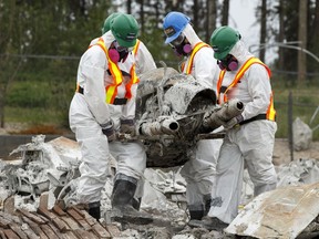A Team Rubicon recovery team in Fort McMurray retrieves precious items — including a motorcycle owned by Quentin Thomas — on June 8, 2016.