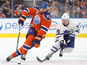 EDMONTON, AB - NOVEMBER 29:  Darnell Nurse #25 of the Edmonton Oilers is pursued by Mitch Marner #16 of the Toronto Maple Leafs on November 29, 2016 at Rogers Place in Edmonton, Alberta, Canada.