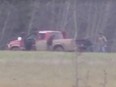 A screen capture from a video released by Alberta Fish and Wildlife showing an alleged deer poaching in progress.
