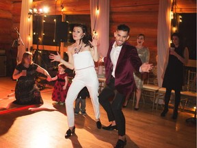 The bride and groom Chantel Cabaj and Andrew Wong dance the Kolomyjka on their wedding day.