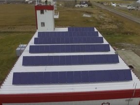 A screen shot from a drone video showing solar panels on the roof of the St. Isidore/Three Creeks Fire Hall.