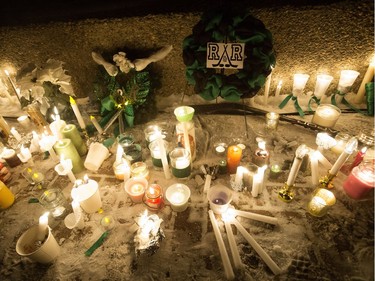 A memorial for Radek MacDougall and Ryder MacDougall sits outside the Stu Barnes Arena following a candlelight vigil for the two boys, in Spruce Grove Thursday Dec. 22, 2016. The two boys were were found dead in their Spruce Grove home on Monday Dec. 19, 2016. Photo by David Bloom