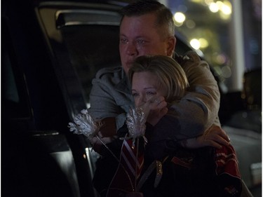 Brent Stark and Tracy Stark watch a candlelight vigil for their sons Radek MacDougall and Ryder MacDougall, in Whitecourt on Tuesday Dec. 20, 2016. The two boys were were found dead in their Spruce Grove home on Monday Dec. 19, 2016.