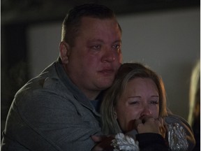 Brent Stark and Tracy Stark take part in a candlelight vigil for their sons Radek MacDougall and Ryder MacDougall, in Whitecourt on Tuesday Dec. 20, 2016. The two boys were were found dead in their Spruce Grove home on Monday Dec. 19, 2016.