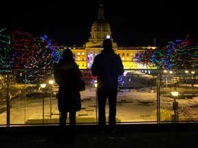 Edmontonians check out the Christmas lights at the Alberta legislature. Dec. 21 is a good time to check out holiday lights because it is the longest night of the year.