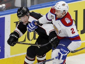 Edmonton Oil Kings defenceman Kyle Yewchuk, right, checks Vancouver Giants forward Taden Rattie at Rogers Place on January 4, 2017.