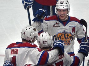 Edmonton Oil Kings forward Trey Fix-Wolansky (27) celebrates his goal against the Victoria Royals with Will Warm (4) and Colton Kehler (23) at Rogers Place in Edmonton on Jan. 19, 2017. (Ed Kaiser)