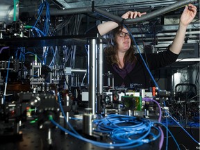 University of Alberta Assistant Professor of Physics Lindsay LeBlanc with the quantum gas apparatus that was used to create Bose-Einstein condensate.