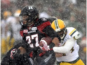 Edmonton Eskimos defensive back Brandyn Thompson tackles Ottawa Redblacks running back Kienan Lafrance in the CFL East Division final at TD Place Stadium on Nov. 20, 2016. (The Canadian Press)