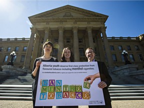(From left) Medical student Lindsay Bowthorpe, high school student Brooklyn Trimble and anti-smoking activist Les Hagen pose for a photo during the Campaign for a Smoke-Free Alberta's press event outside the Alberta Legislature Building in Edmonton, Alta. on Thursday, May 28, 2015. The group called for a ban on menthol tobacco.