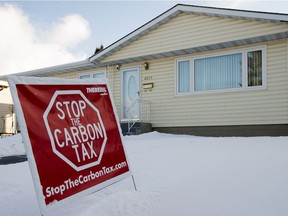 An anti-carbon tax sign on the front lawn of a home in Edmonton.