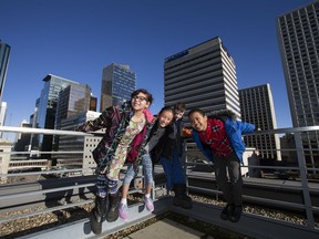 Grade 4 students Sky McGillis, 10, Jasmine Cherrett, 9, Terek Johnson, 9, and Fuad Diriye, 9, pose for a photo after discussing how they would make the city more child friendly Friday Jan. 20, 2017.