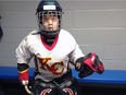 Connor Young, 7, is an avid hockey player on the minor league team the Ice Ninjas. His hand was fitted for a device that allows him to properly hold a stick despite a congenital abnormality.