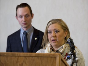 Conservative MP Michael Cooper, St. Albert-Edmonton, joins Shelly MacInnis-Wynn, the widow of Const. David Wynn, at a press conference on Friday, Dec. 9, 2016  in St. Albert.