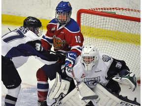 Edmonton Oil Kings' Tyson Gruninger gets pushed by Swift Current Broncos' Tyler Steenbergen during pre-season action at Servus Place in St. Albert, Aug. 30, 2014. (File)