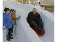 Coun. Ben Henderson goes for a wild ride down the ice slide outside Cafe Bicyclette in Edmonton on Monday, Jan. 30, 2017, after announcing the Winter Cities Shake-Up Conference which takes place February 16-18, 2017 at the Shaw Conference Centre in Edmonton. This international conference celebrates successful winter cities, exploring new approaches to winter living in the areas of business, urban design and culture.