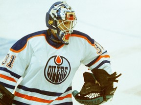 Goalie Curtis Joseph makes his debut for the Edmonton Oilers against the Buffalo Sabres at Edmonton Coliseum on Jan. 13, 1996.