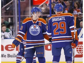 Edmonton Oilers centre Ryan Nugent-Hopkins (left) and Leon Draisaitl chat before a faceoff against the Dallas Stars at Rexall Place Dec.r 4, 2015. (Ian Kucerak)