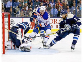 Sergei Bobrovsky of the Columbus Blue Jackets stops a shot by Edmonton Oilers captain Connor McDavid as Jackets teammates Seth Jones looks to clean up the rebound at Nationwide Arena in Columbus, Ohio, on Jan. 3, 2017. Columbus defeated Edmonton 3-1 to win their 16th consecutive game. (Kirk Irwin/Getty Images)